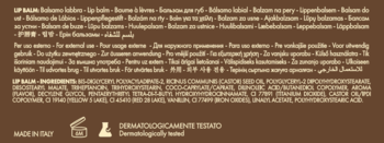 Tył opakowania balsamu do ust z listą składników, napisem "Dermatologicznie Testowany" i "Made in Italy" na brązowym tle.