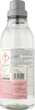 Tył przezroczystej butelki płynu do prania/płukania 720ml z szarą nakrętką i biało-różową etykietą z kodem EAN.