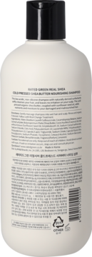 Tył butelki szamponu Rated Green Real Shea Cold Pressed Shea Butter, biała z czarną nakrętką i etykietą ze składem.