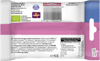 Tył organicznego batonika owsianego z jabłkiem, malinami i truskawkami, różowo-białe opakowanie, tabela wartości odżywczych.