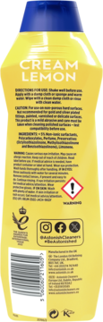 Tył żółtej butelki Astonish Cream Lemon mleczka czyszczącego z opisem składników i ostrzeżeniami.