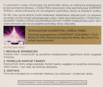 Informacyjny tekst L'Oréal Ekspert Wieku 60+ o odbudowującym kremie, potrójnej mocy, na beżowym tle z różową kroplą.