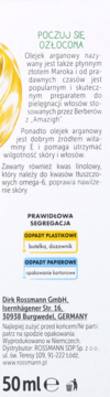 Tył opakowania olejku do włosów Rossmann 50 ml. Biała etykieta z opisem olejku arganowego, recyklingu i danymi producenta.