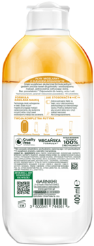 Tył butelki Płynu Micelarnego Garnier z Olejkiem Arganowym 400ml. Biała z warstwą olejku, etykieta, logo Vegan, Cruelty Free.