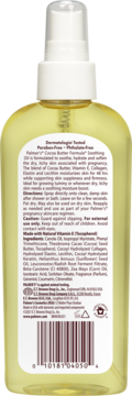 Tył przezroczystej butelki Palmer's Cocoa Butter Soothing Oil, żółtawa ciecz, biały atomizer, etykieta ze składem.