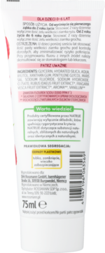 Tył tubki truskawkowej pasty do zębów dla dzieci 0-6 lat, z instrukcjami, składem i fluorkiem sodu.
