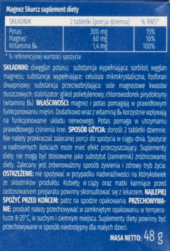 Tył ciemnoniebieskiego opakowania Magnez Skurcz suplement diety, z tabelą składników i szczegółowym opisem działania.