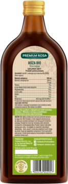 Tył brązowej butelki soku z dzikiej róży Premium Rosa Bio. Etykieta z tabelą wartości odżywczych, witaminą C i kodem.