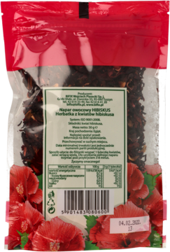 Tył przezroczystego opakowania herbaty HIBISKUS z suszonych kwiatów. Widoczna zielona etykieta z informacjami i kodem kreskowym.