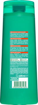 Tył zielonej butelki szamponu Garnier Fructis Grow Strong na wypadanie włosów, z tekstem i kodem kreskowym.