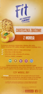 Tył żółtego opakowania Fit Ciasteczek Zbożowych z Morelą, bez dodatku cukru, z opisem korzyści i składników.