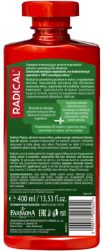 Tylna strona czerwonej butelki szamponu Radical przeciw wypadaniu włosów z zieloną etykietą i opisem produktu.