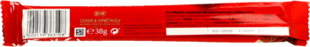 Tył czerwonego opakowania mlecznej czekolady z nadzieniem, widoczny kod kreskowy i gramatura 100g.
