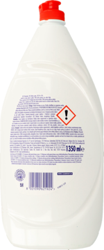 Tył białej butelki Fairy płynu do naczyń, z czerwoną nakrętką, widocznymi ostrzeżeniami i pojemnością 1350ml.