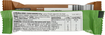 Tył zielono-brązowego opakowania batona enerBio kakao 40g, z listą składników i tabelą wartości odżywczych.