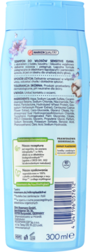 Tył opakowania szamponu Isana Sensitive 300 ml z ekstraktem z bawełny, niebieska butelka z opisem składników.