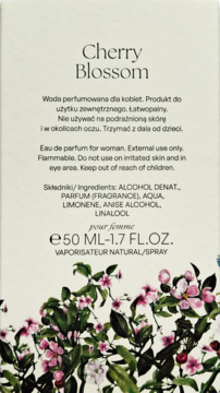 Tył opakowania damskiej wody perfumowanej Nou Cherry Blossom. Białe tło, skład, pojemność, kwiatowy wzór.
