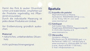 Etykieta łopatki do patelni z drewna oliwnego. Białe tło, niebieski tekst, szczegóły produktu i instrukcje pielęgnacji.