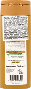 Tył złotego opakowania brązującego balsamu Rossmann 200ml z napisem, listą składników, informacją o weganizmie.