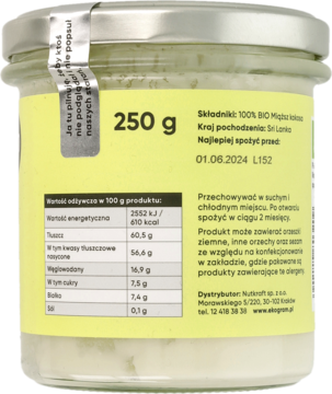 Tył szklanego słoika BIO pasty kokosowej 250g, widoczna kremowa zawartość i etykieta z danymi.