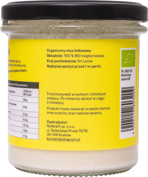 Tył słoika organicznej pasty kokosowej BIO z żółtą etykietą, widoczny skład 100% kokos i tabela wartości odżywczych.