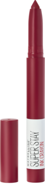 Czerwona pomadka Maybelline Super Stay Ink Crayon z odkrytą końcówką w kształcie kredki, obok leży skuwka.