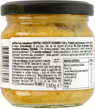 Tył szklanego słoika enerBio Pasta Papryka i Orzechy Nerkowca 180g, z widoczną białą etykietą i składem.