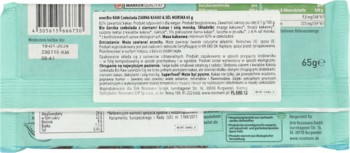 Tył zielonej paczki czekolady Bio Raw 65g, z etykietą opisującą chrupiące kakao, daktyle i sól morską.
