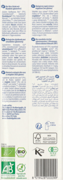 Tył białego opakowania ekologicznego napoju ryżowego z migdałami, certyfikaty, barcode i tekst.