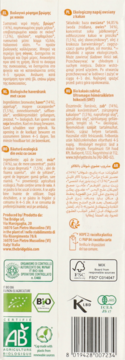 Tył białego opakowania napoju owsianego z kakao, z informacjami o składzie, certyfikatami i kodem kreskowym.