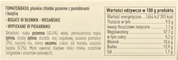 Tył opakowania chlebków pszennych Tomato&Basil, z listą składników, wartościami odżywczymi i hasłami wegańskie, wypiekane w piekarniku.