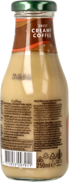 Tył szklanej butelki Starbucks Sweet Creamy Coffee 250ml. Widać etykietę z opisem mlecznego napoju kawowego.