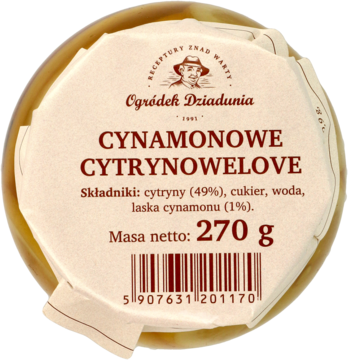 Słoik 'Ogródek Dziadunia Cynamonowe Cytrynowelove' 270g w żółtym syropie, etykieta z góry, widoczne plastry cytryny.