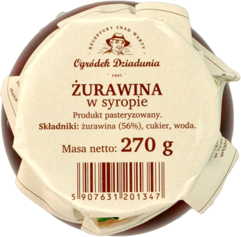 Żurawina w syropie Ogródek Dziadunia 270 g. Okrągły słoik z beżową etykietą na pokrywce, widok z góry.