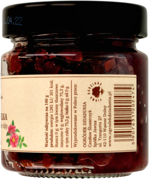 Tył szklanego słoika konfitury z płatków róży, z etykietą zawierającą skład i dane producenta.