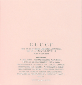 Tył jasnoróżowego opakowania perfum Gucci Bamboo, z widocznym logo, listą składników i adresem strony.