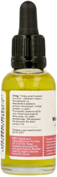 Tył żółtego serum do włosów niskoporowatych z czarnym aplikatorem, widoczna etykieta ze składem.