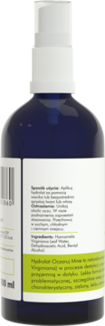 Tył ciemnoniebieskiej butelki hydrolatu oczarowego 100ml, widoczna etykieta ze składnikami na skórę problematyczną.