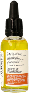 Tył żółtej butelki serum do twarzy z czarnym zakraplaczem, widoczna biała etykieta z listą składników INCI.