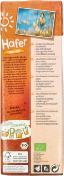 Tył brązowego kartonu Natumi napoju owsiano-migdałowego 1l. Widoczny tekst o składzie bez laktozy i logo bio.