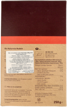 Tył opakowania ekologicznego makaronu penne z ryżu brązowego 250g, z polskimi i niemieckimi etykietami.