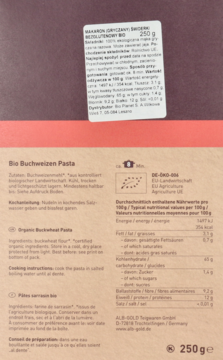 Tył brązowego opakowania Bio makaronu gryczanego świderki, bezglutenowego, z widoczną tabelą odżywczą.
