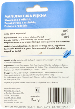 Tył opakowania kuli do kąpieli Manufaktura Piękna. Niebiesko-białe, z polskim tekstem, kodem kreskowym i wagą 105g.
