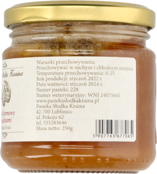 Tył szklanego słoika z kremowym miodem malinowym 250g, widoczna etykieta z datami ważności i kodem.