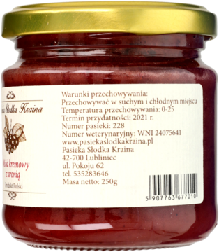 Tył szklanego słoika miodu kremowego z aronią "Pasieka Słodka Kraina" z etykietą i masą netto 250g.