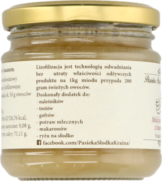 Tył szklanego słoika miodu kremowego z bananem, z etykietą opisującą liofilizację i zastosowania produktu.