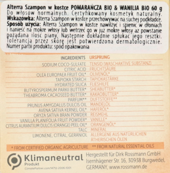 Zbliżenie na tył beżowego opakowania Alterra Szampon w kostce Pomarańcza Wanilia BIO 60g, z czytelną listą składników.