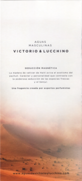 Plakat Victorio & Lucchino N°3 Seducción Magnética, męska woda toaletowa na tle pustyni, biała góra, brązowy dół.