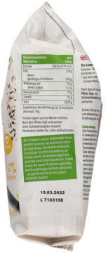 Tylna strona białej torebki mielonych nasion słonecznika Bio enerBiO z zieloną tabelą odżywczą i datą.