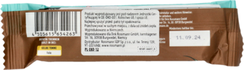 Tył brązowego opakowania bio-batonika kokosowego w gorzkiej czekoladzie, z kodem kreskowym i datą 11.09.24.
